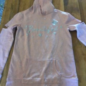 A pink justice hoodie